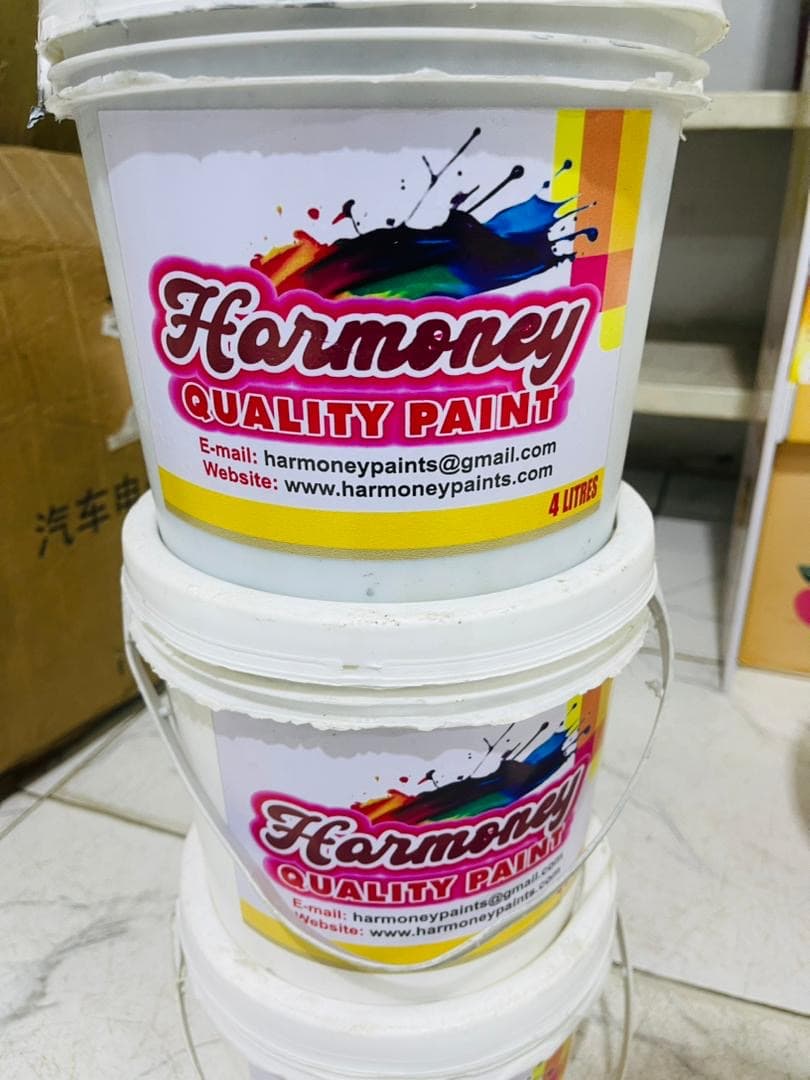 Close-up of Harmoney Paints product packaging.